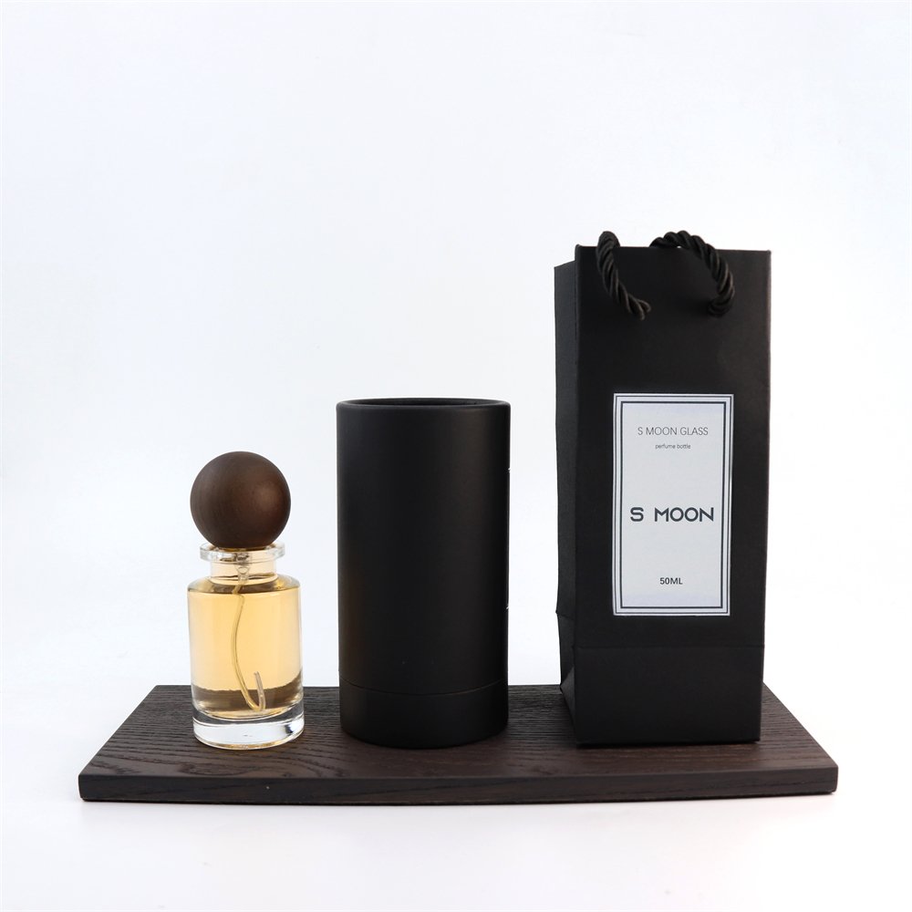 New Style Various Perfume Bayonet Bottle Cylinder Thick Bottom 100ml Glass Perfume Bottle with Black Wooden Round Ball Cover