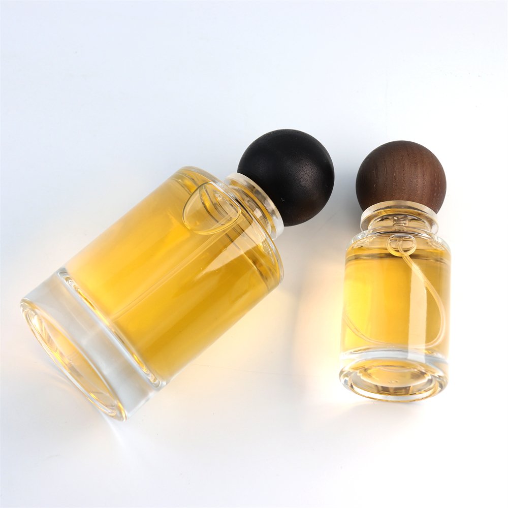 New Style Various Perfume Bayonet Bottle Cylinder Thick Bottom 100ml Glass Perfume Bottle with Black Wooden Round Ball Cover