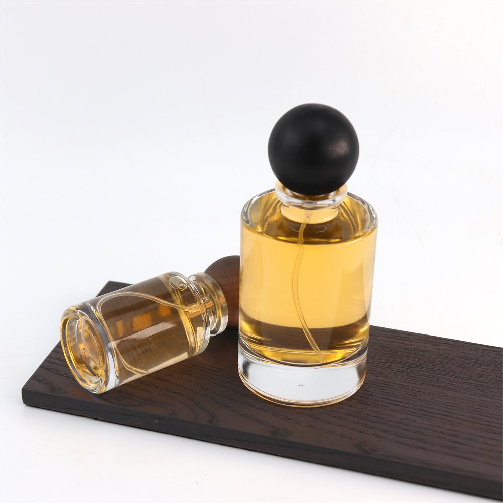 New Style Various Perfume Bayonet Bottle Cylinder Thick Bottom 100ml Glass Perfume Bottle with Black Wooden Round Ball Cover