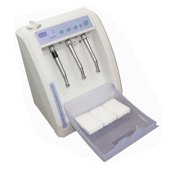 Dental handpiece lubricating and cleaning machine
