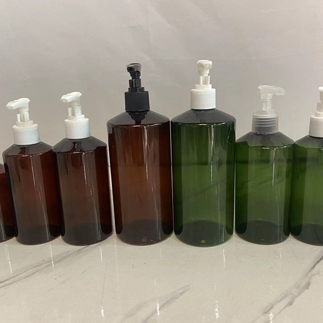 Hengjian 100ml 150ml 200ml 300ml 500ml plastic amber green shower gel bottle with pump for shampoo cosmetic lotion cream bottle