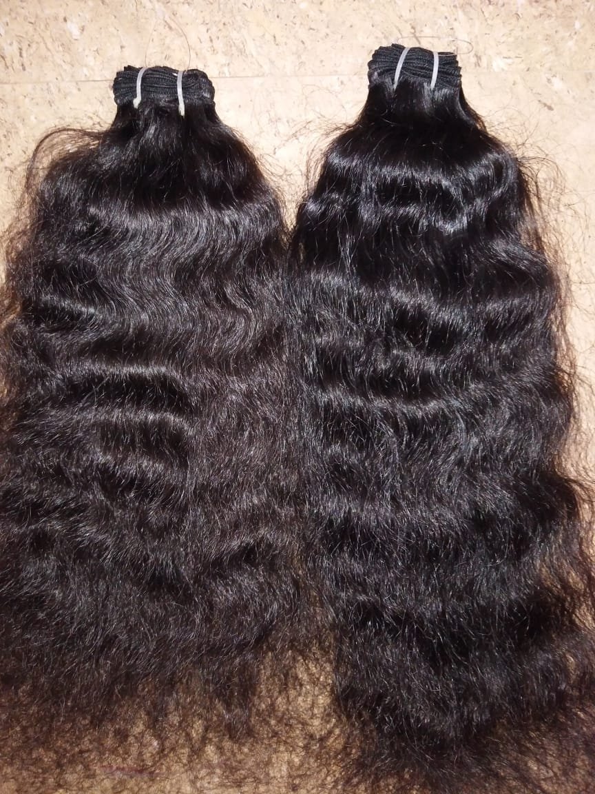 Curly human hair extensions
