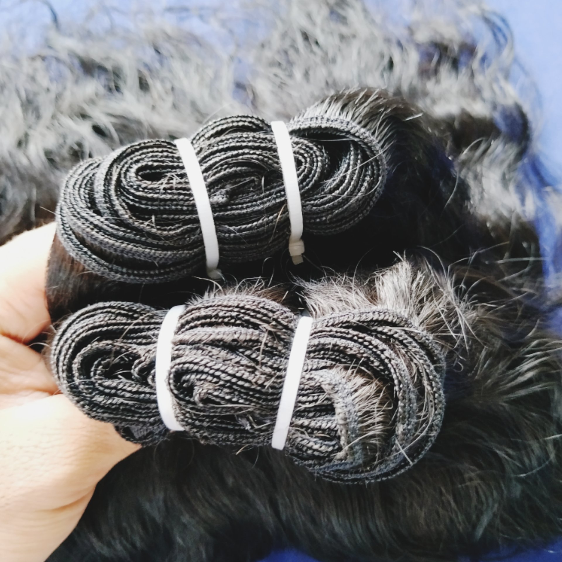 Wholesale cheap Price 100% Raw Unprocessed Natural Genius Weft Black Wavy Indian Temple Indian Human Hair Extensions