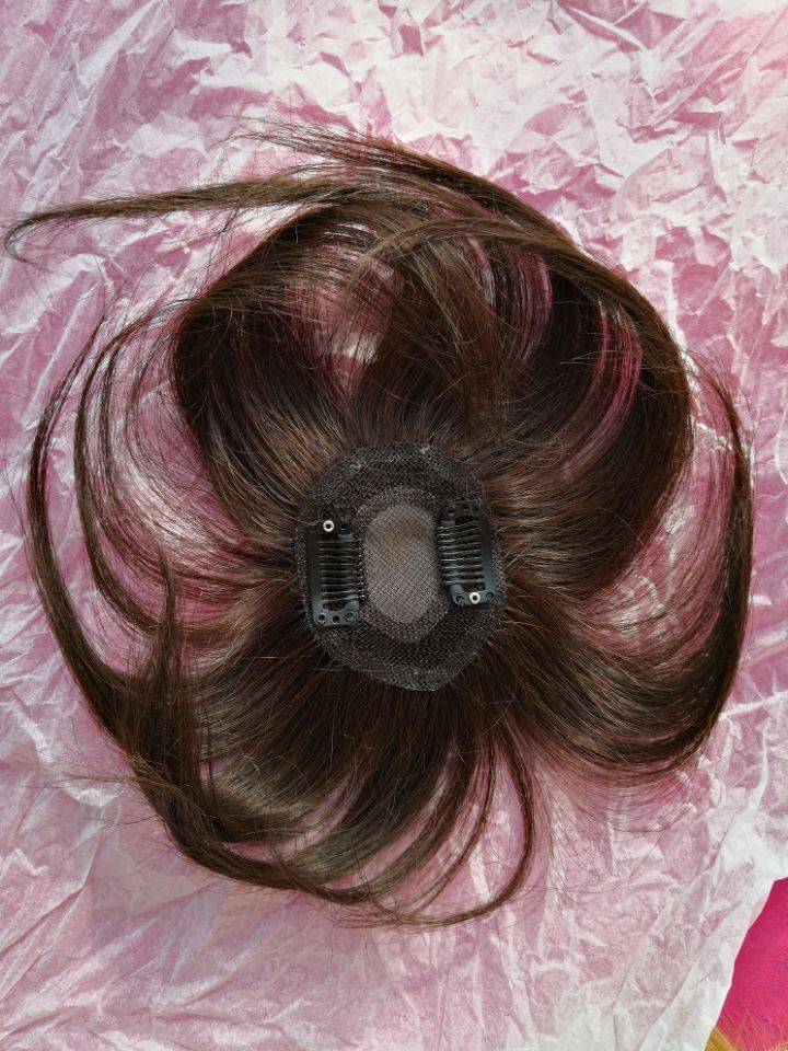 The hair on the top of the head, the white hair, the lady's hair, the hair, the curly hair, the straight hair is invisible without marks
