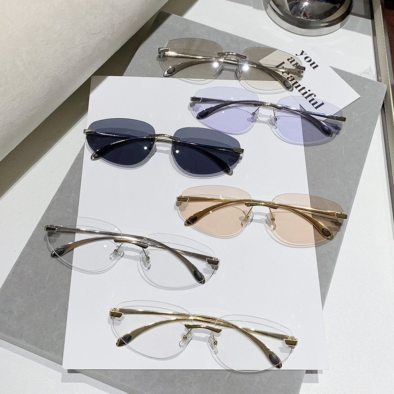 New styles rimless metal oval fashion y2k sun glasses INS popular famous brand designer women's sunglasses