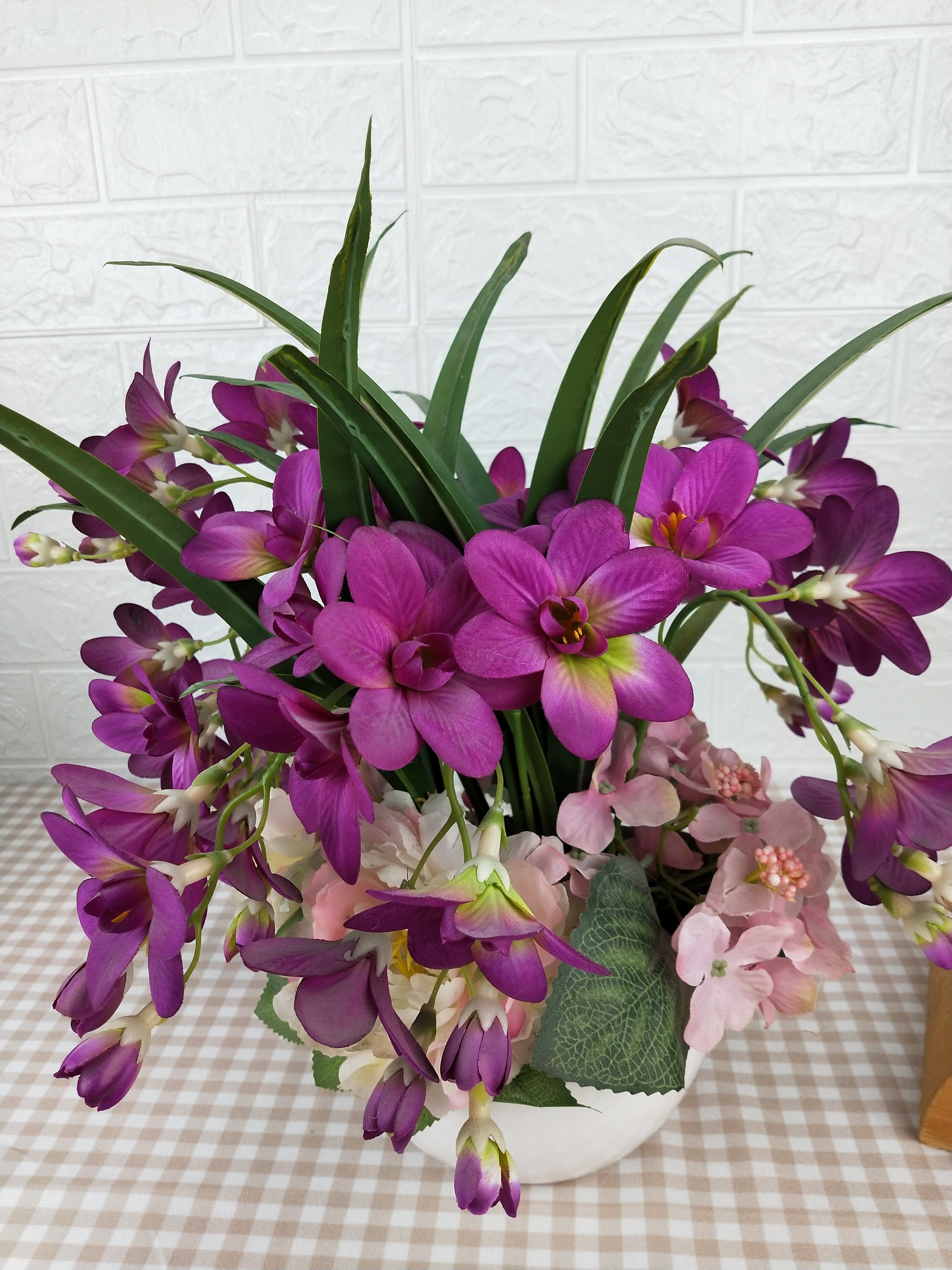 Handicraft and art design look real artificial flower arrangement blossom orchid with ceramic pot for home decor