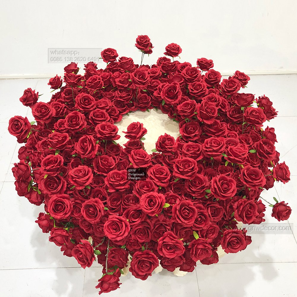 Elegant wedding artificial green white rose arrangement decorated foliage cake table florals