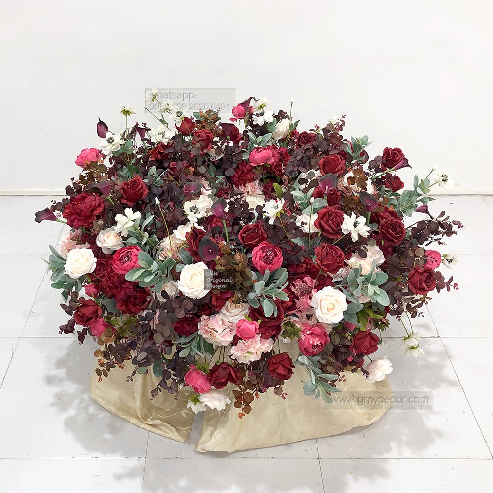 Elegant wedding artificial green white rose arrangement decorated foliage cake table florals