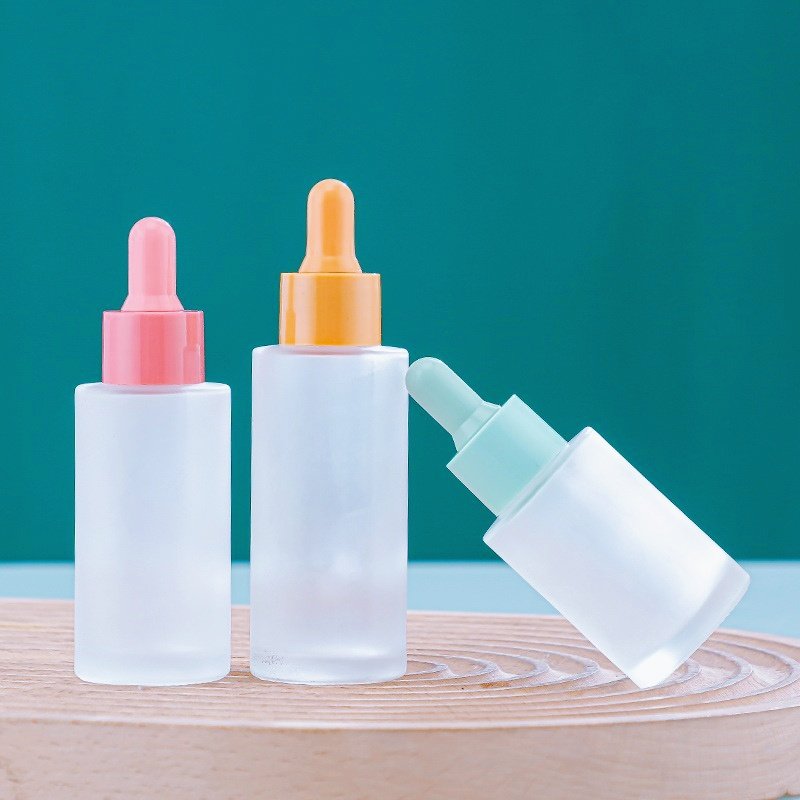 Luxury cosmetic container round flat shoulder colorful frosted perfume bottle essential oil serum glass dropper bottle