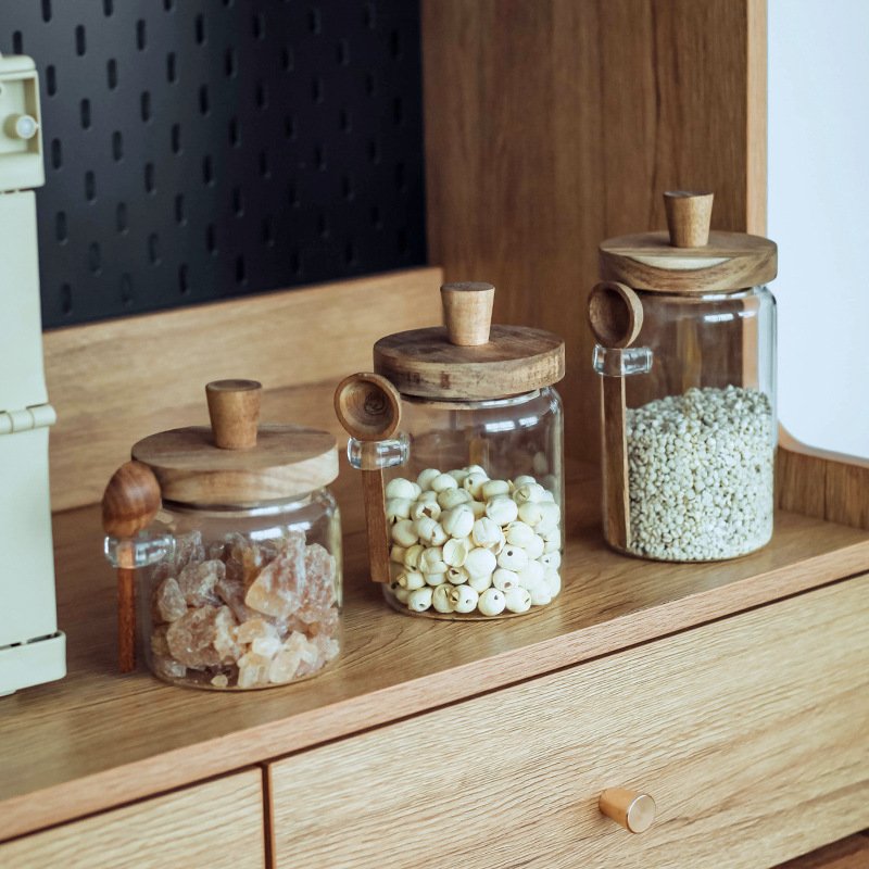 Wholesale 300ml-900ml kitchen food grade Transparent glass storage jar Wooden lid with wooden spoon