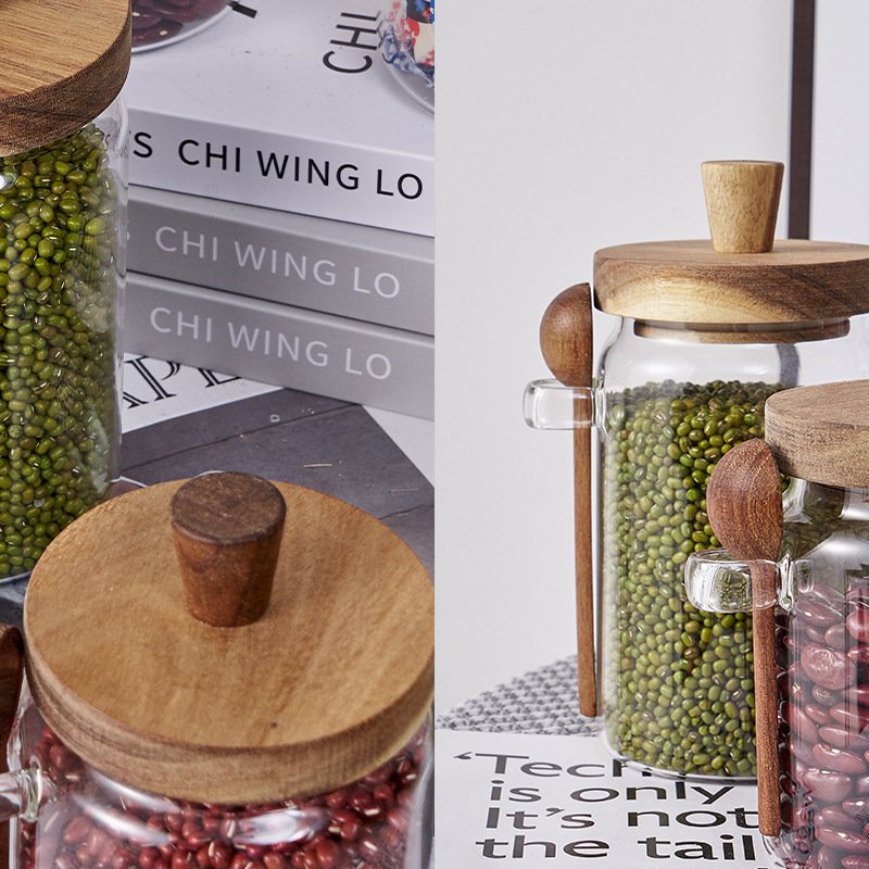 Wholesale 300ml-900ml kitchen food grade Transparent glass storage jar Wooden lid with wooden spoon