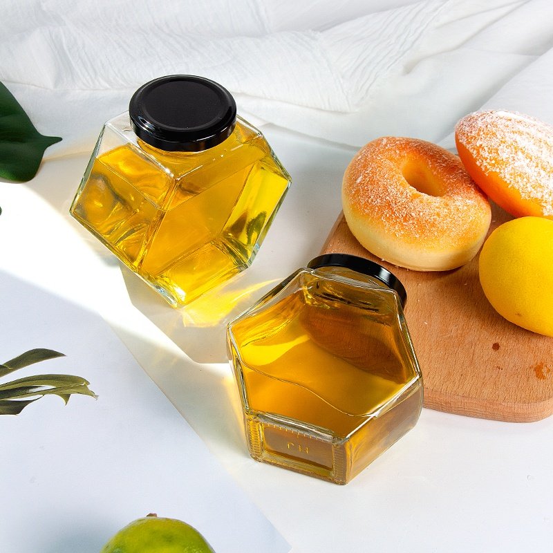 Wholesale Hexagonal Glass Container Storage Honey Bottle Jars For Honey Metal Lid Food Storage Bottle Glass Honey Pot