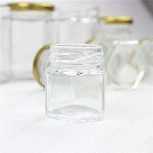 Wholesale 30ml 50ml 60ml Clear Glass Storage Jar Hexagon Kitchen Glass Bottle Round Glass Honey Jar With Gold Lids