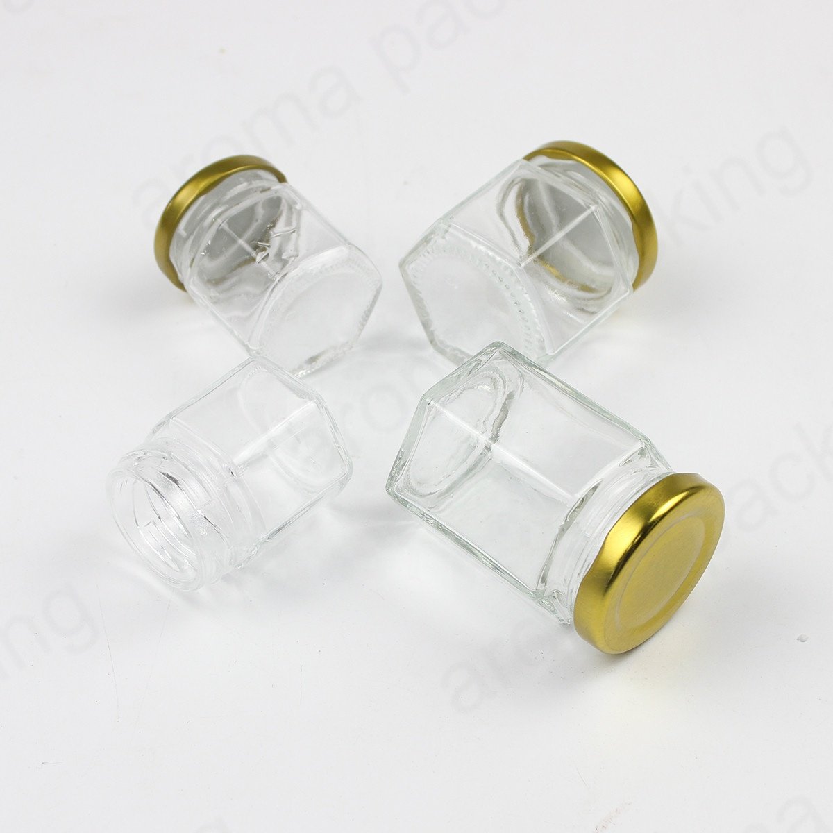 Wholesale 30ml 50ml 60ml Clear Glass Storage Jar Hexagon Kitchen Glass Bottle Round Glass Honey Jar With Gold Lids