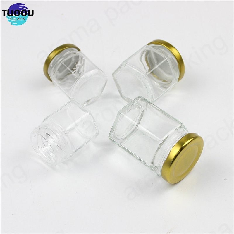 Wholesale 30ml 50ml 60ml Clear Glass Storage Jar Hexagon Kitchen Glass Bottle Round Glass Honey Jar With Gold Lids