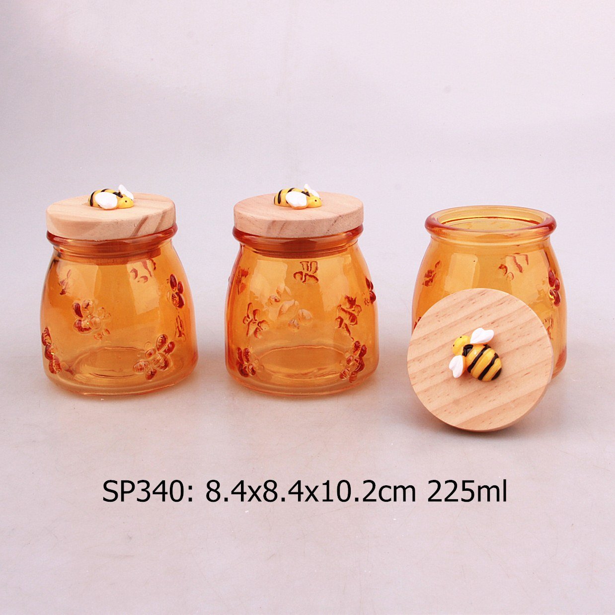 Manufacturer Custom Food Grade Empty Clear Honey glass jar with wooden lid and bee-shaped plastic decorative