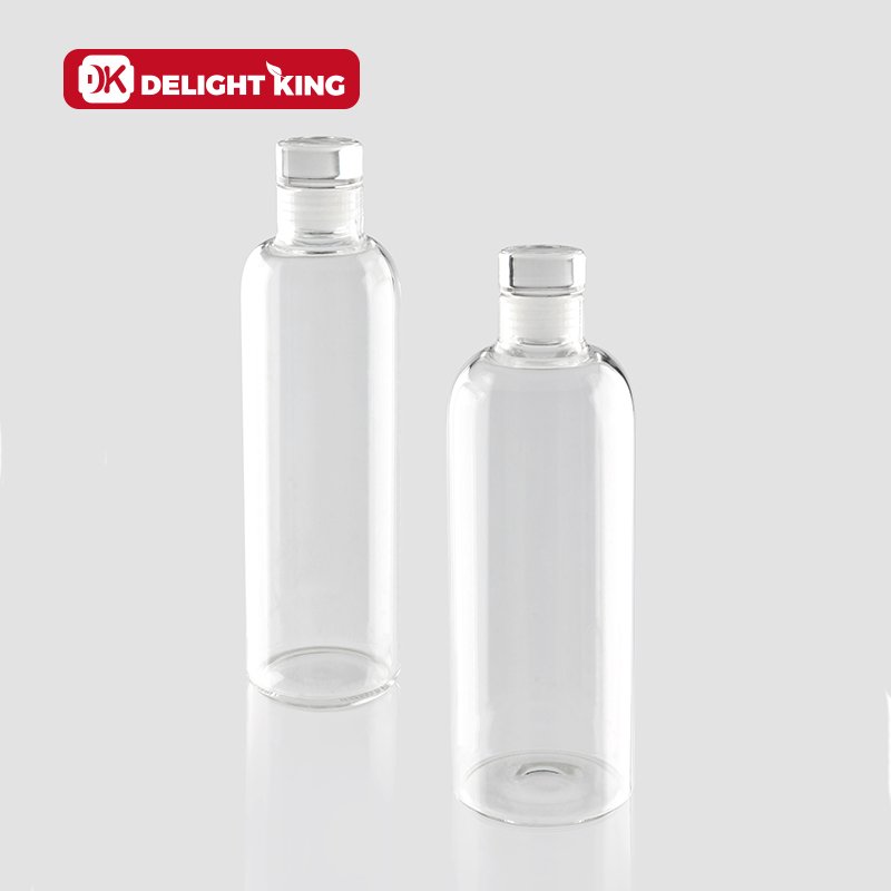 High Borosilicate Custom Logo Clear Glass drinking Bottle Luxury Style Smooth Glass Water Bottle With Sealing Glass lid