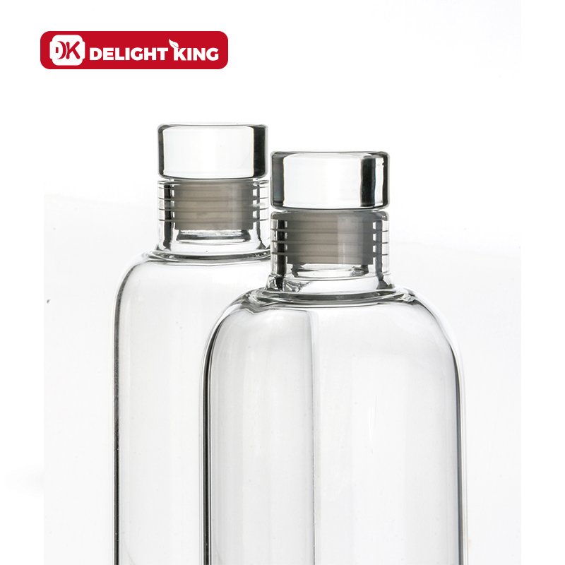 High Borosilicate Custom Logo Clear Glass drinking Bottle Luxury Style Smooth Glass Water Bottle With Sealing Glass lid