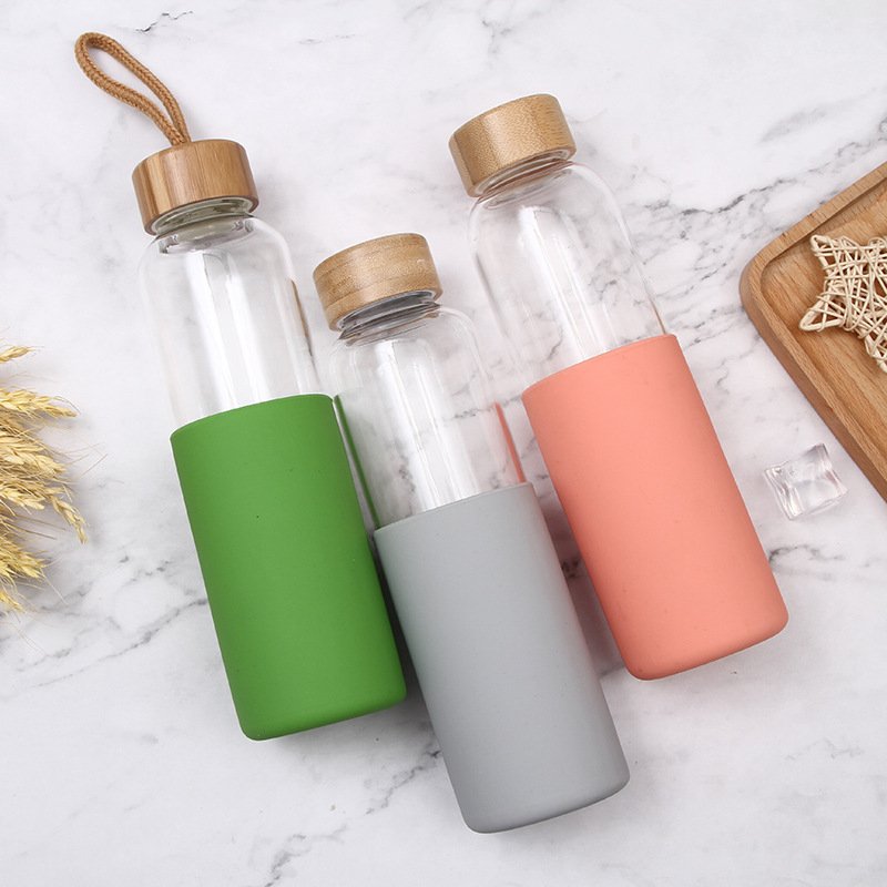 Hot Selling 20oz Borosilicate Drinkware tomatodo botella de agua Tumbler Glass Water Bottle With Silicone Sleeve Bamboo Lid