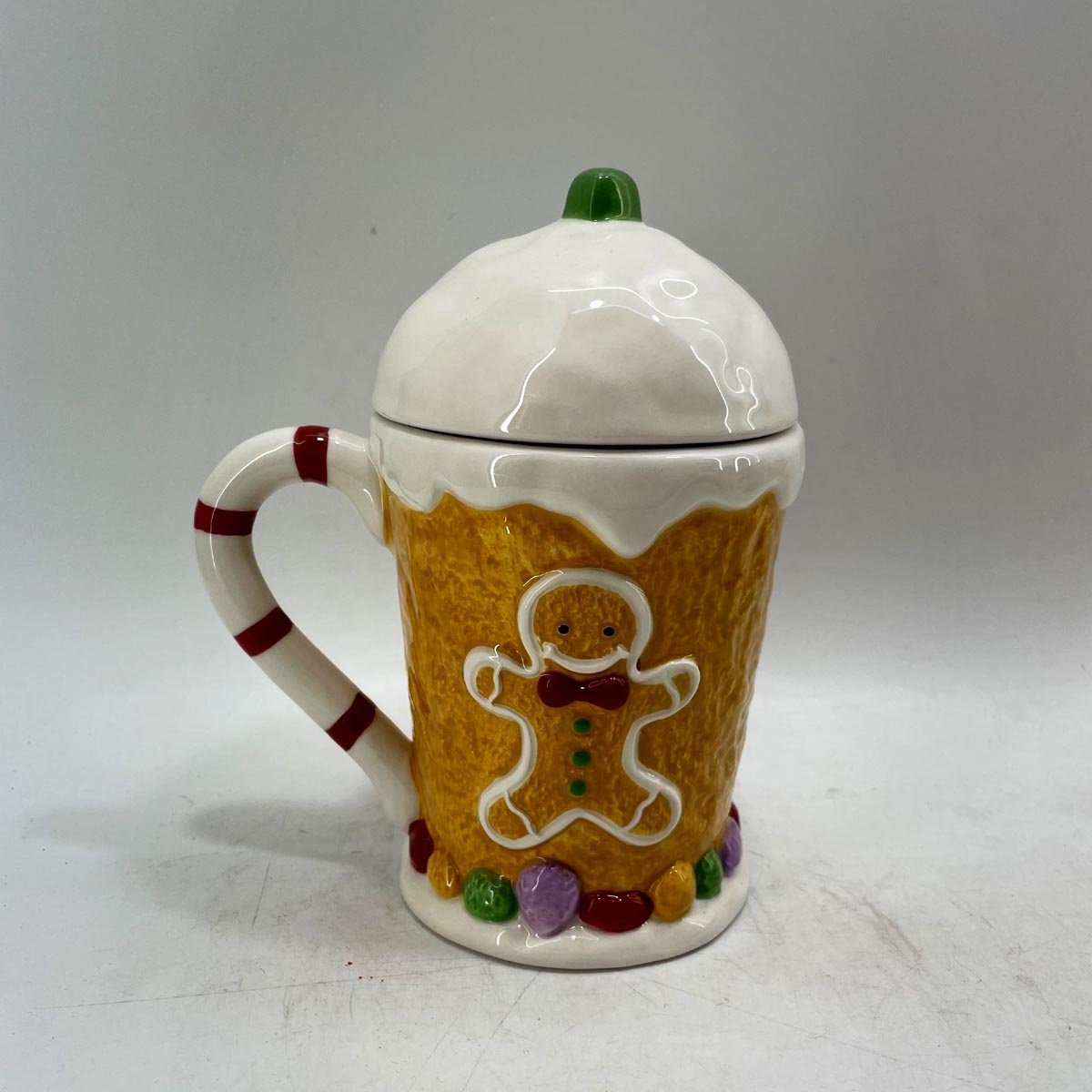 Hand painted ceramic gingerbread mand coffee mug with lid
