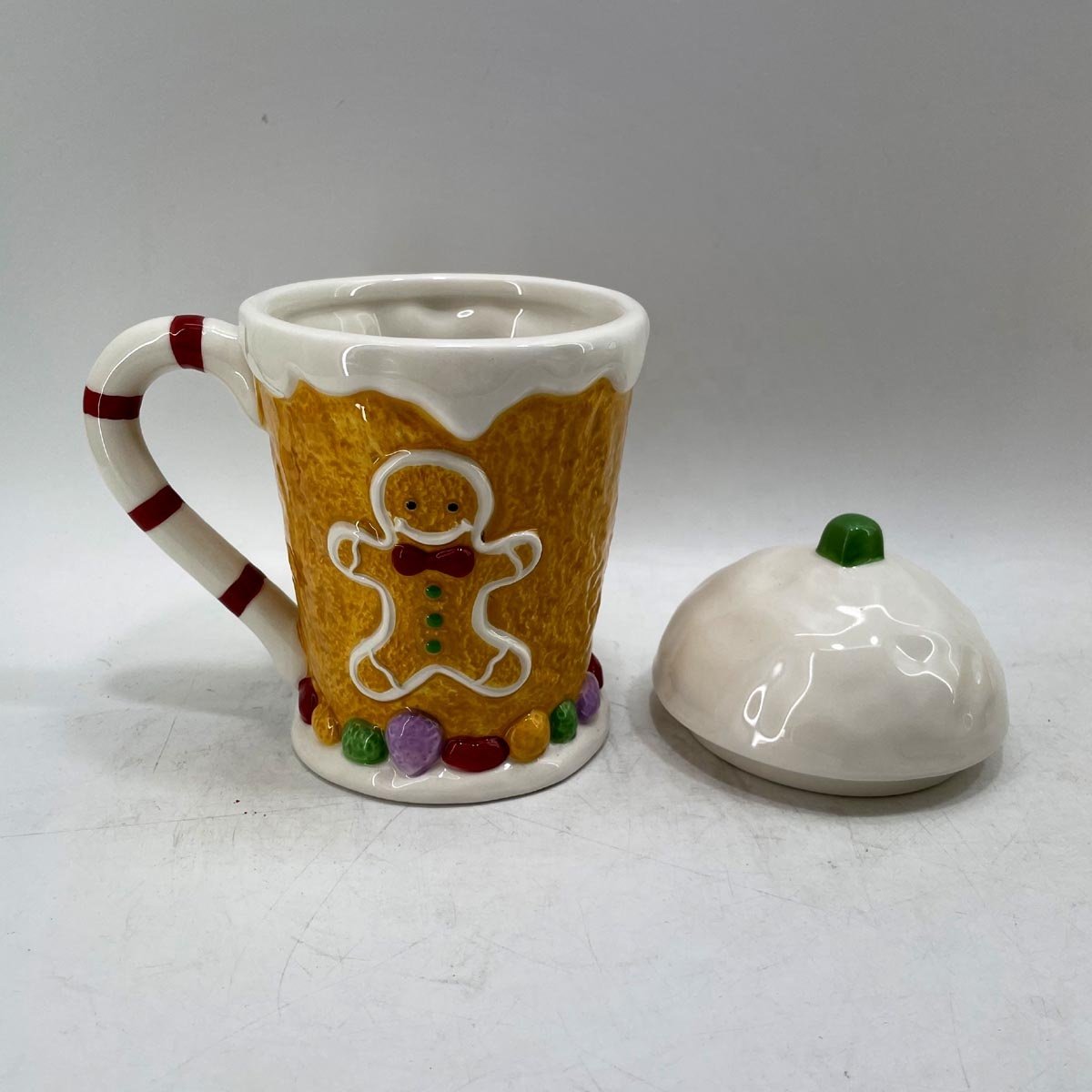 Hand painted ceramic gingerbread mand coffee mug with lid