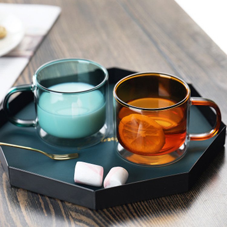 Clear cylindrical coffee mug with heat resistant handle and coloured double wall glass mug