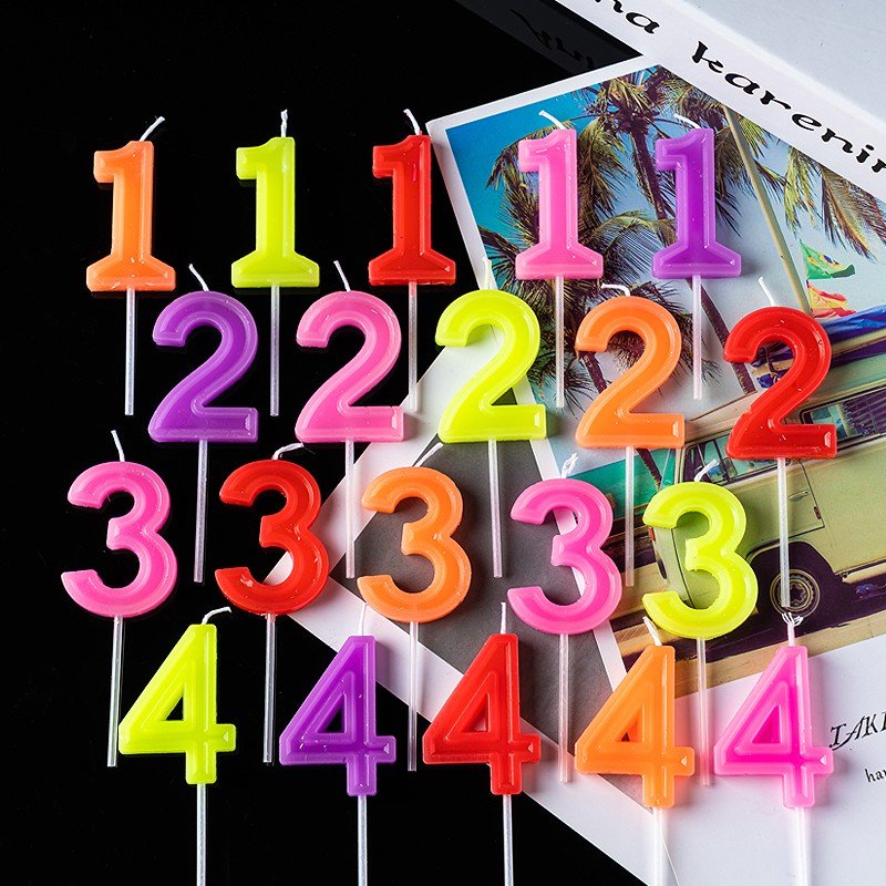 Colorful digital birthday candle individual package with base for birthday votive party cake with decorative baking supplies