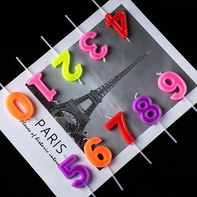 Colorful digital birthday candle individual package with base for birthday votive party cake with decorative baking supplies