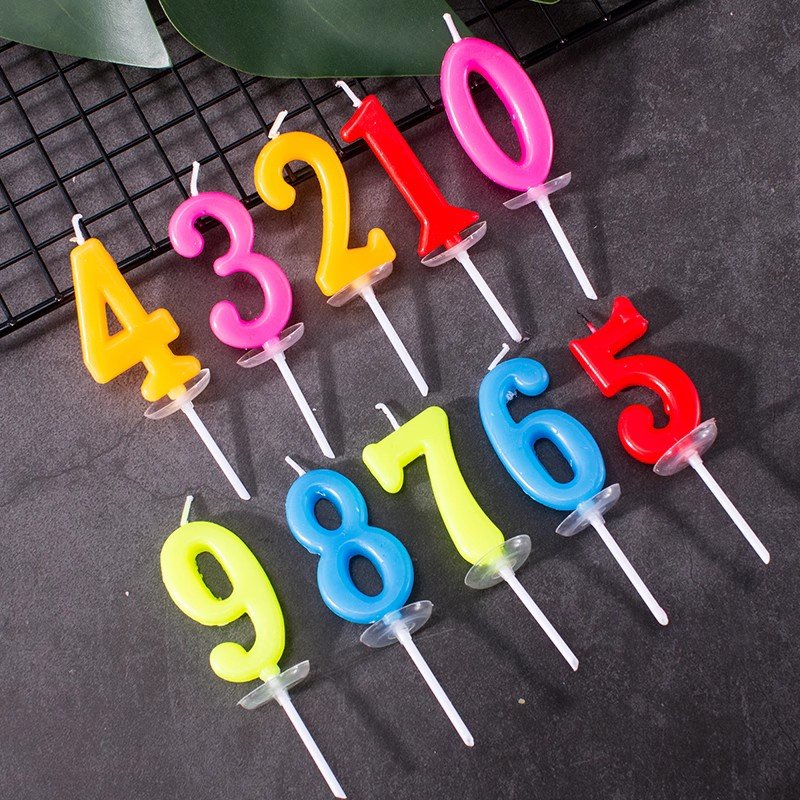 Colorful digital birthday candle individual package with base for birthday votive party cake with decorative baking supplies