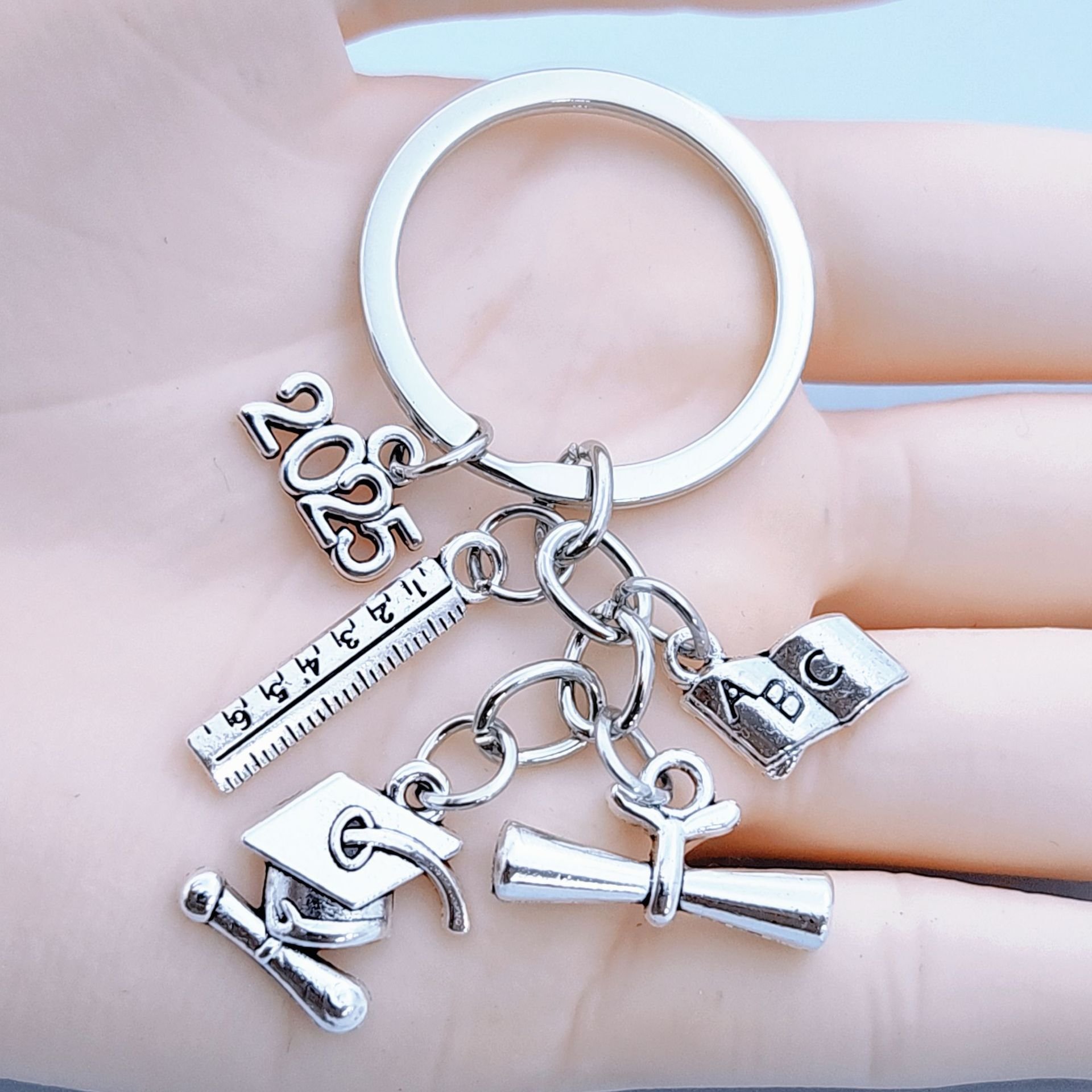 2025 European American Fashion Light Keychain Bachelor's Hat Key Ring Book Roll Graduation Badge Metal Cross-Border Wholesale