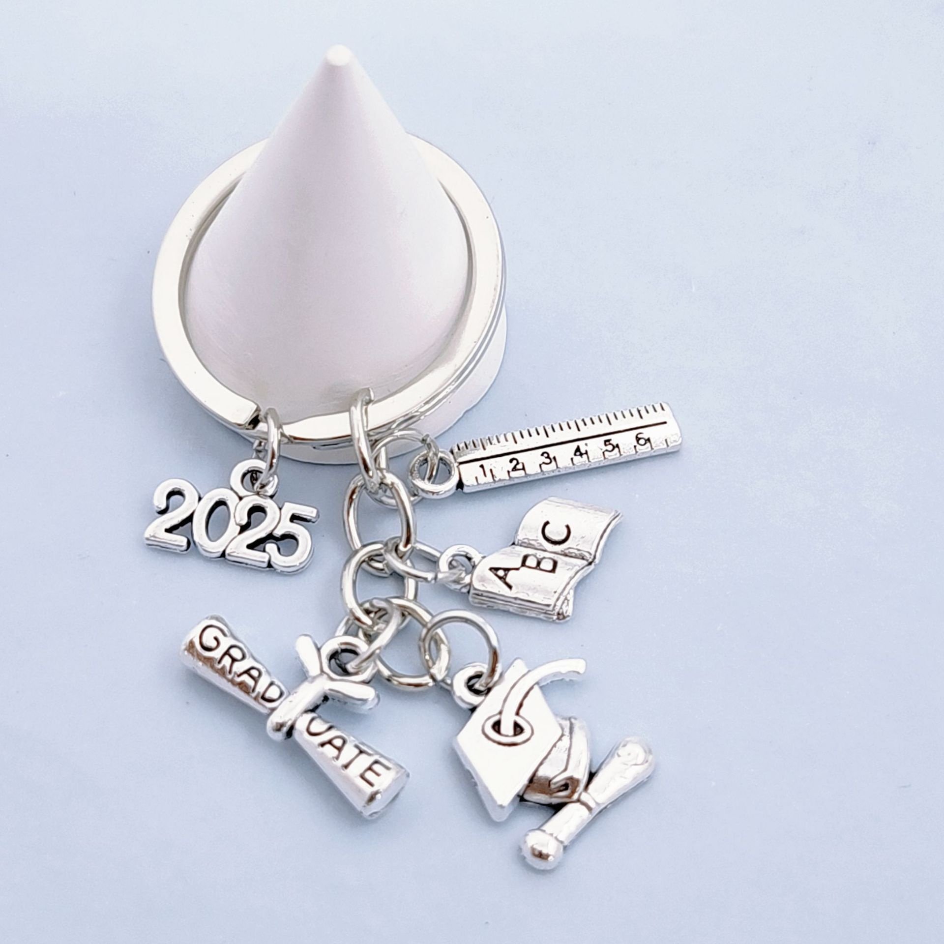 2025 European American Fashion Light Keychain Bachelor's Hat Key Ring Book Roll Graduation Badge Metal Cross-Border Wholesale