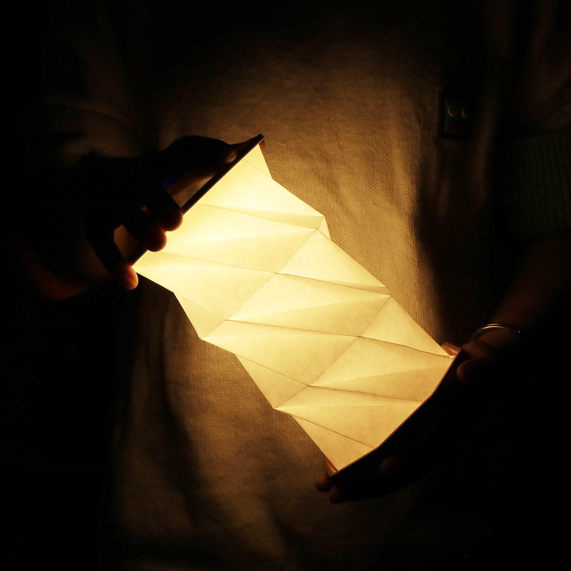 Portable Rechargeable Black Origami Book Night Light Adorned with Cubist-Inspired Graphics for Concert Hall