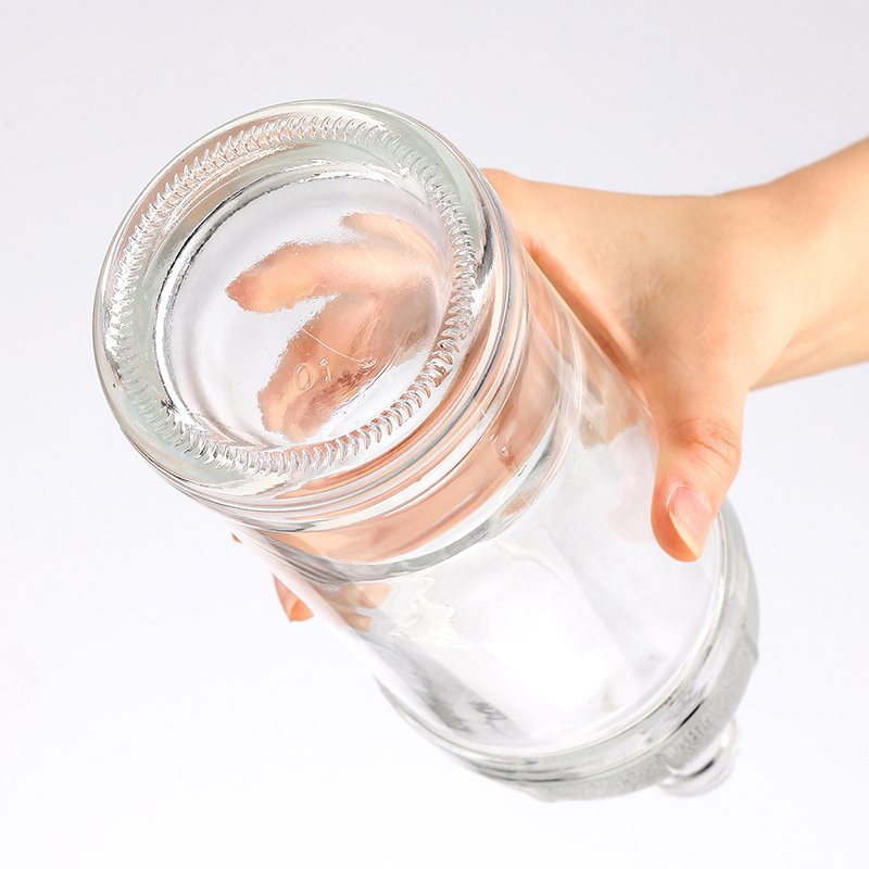 Factory direct sales wholesale customized logo empty glass wine bottle beverage bottle water bottle with lid