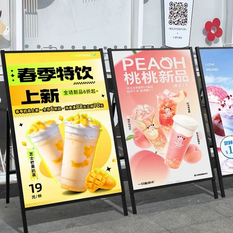 The sidewalks are flanked by double-sided iron billboard poster stands