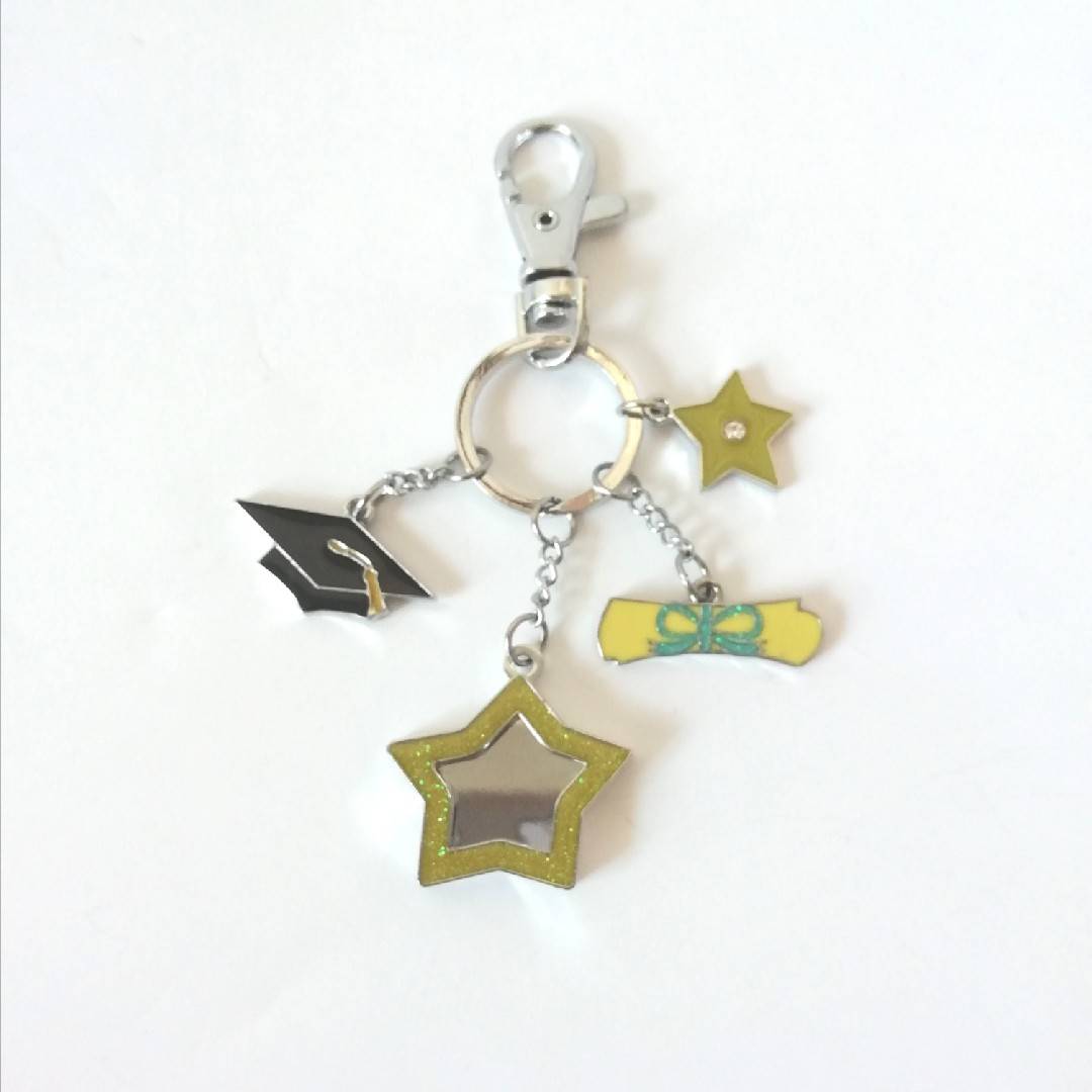 Graduate accessories can be placed on keychain to send classmates and friends