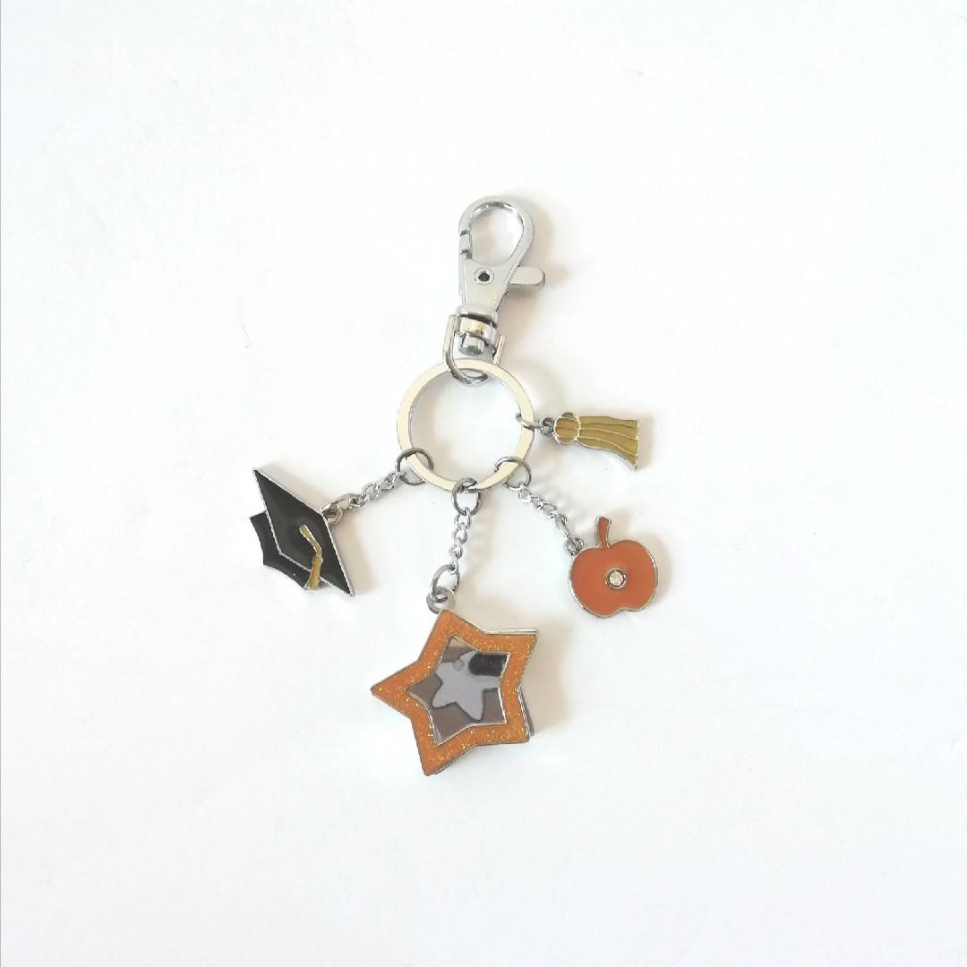 Graduate accessories can be placed on keychain to send classmates and friends
