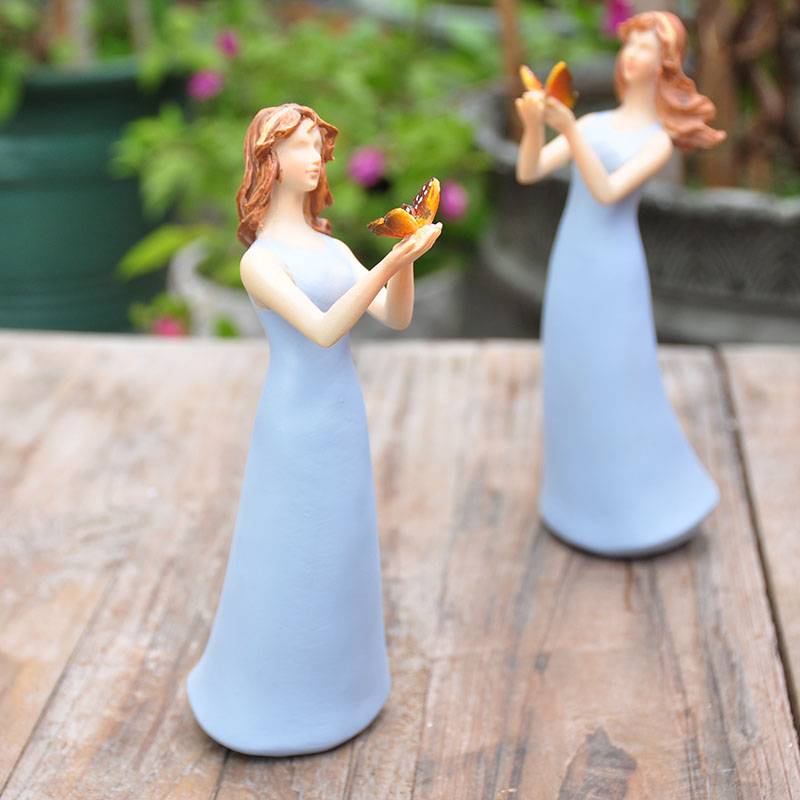 Rural pastoral blue clothes holding a butterfly girl Angel Garden Fun Scene decorative gift
