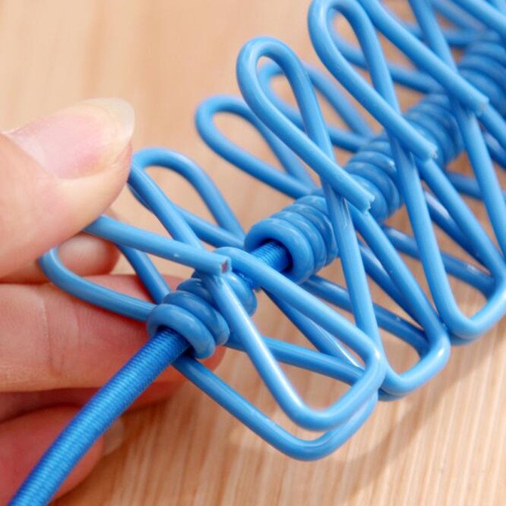 Durable flexible elastic retractable clothesline with colored metal clips