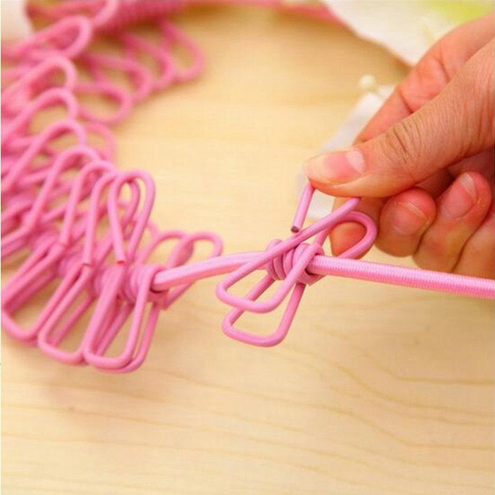 Durable flexible elastic retractable clothesline with colored metal clips