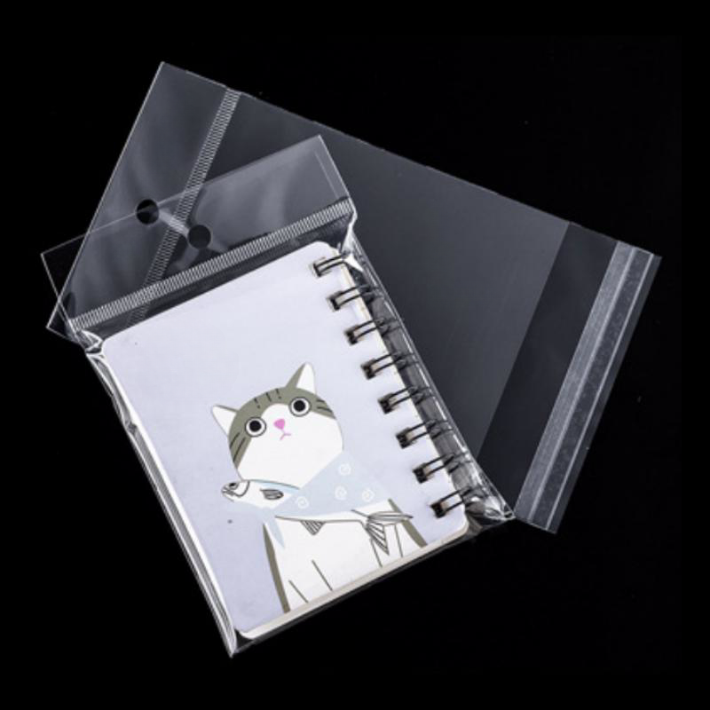 Hot-selling clear self adhesive cellophane plastic packaging bags with head hole transparent opp bags for packing