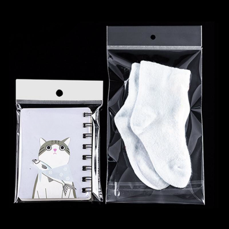 Self-adhesive transparent opp plastic packaging bags for packing clear self adhesive seal cellophane bag with hanging hole