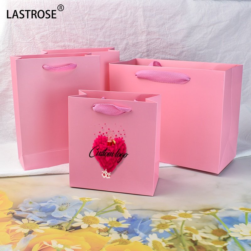 Recyclable pink gift bags with your own logo luxury shopping bags wholesale paper packaging handbag for women cosmetic bags