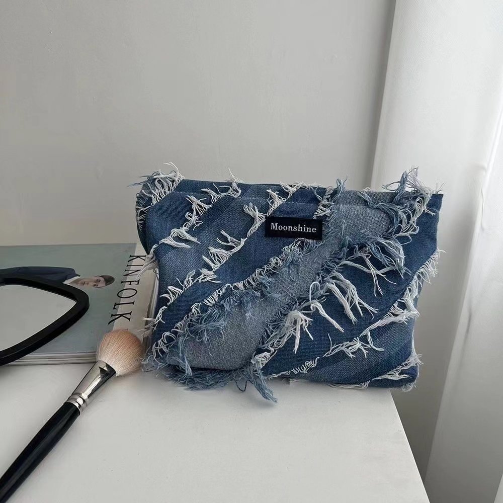 Small and high-end denim tassel makeup bag, large capacity storage bag, portable toiletry bag, lotion brush bag, organizing bag