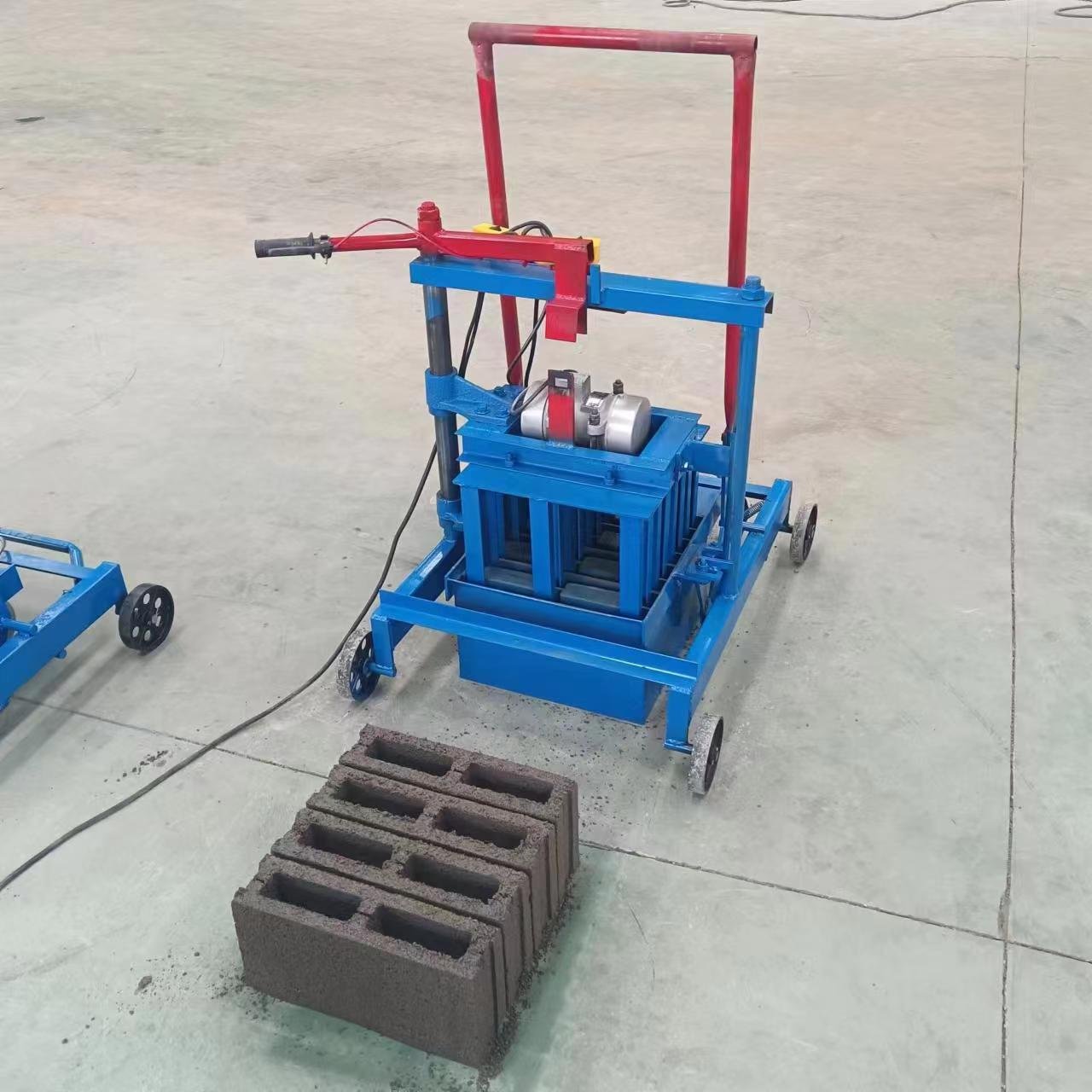 Egg laying concrete block making machine