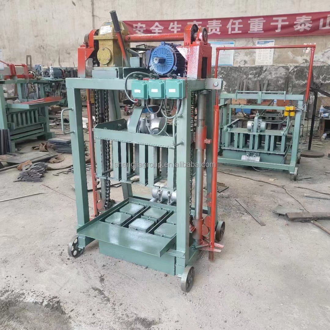 Low cost mobile egg laying type simple operation cement concrete brick making machine