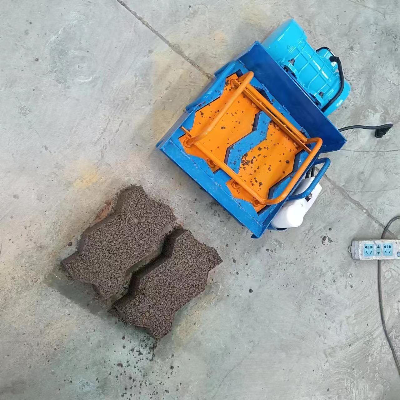 Best selling rural household manual brick making machine one piece at a time portable brick making machine two-phase electric ho