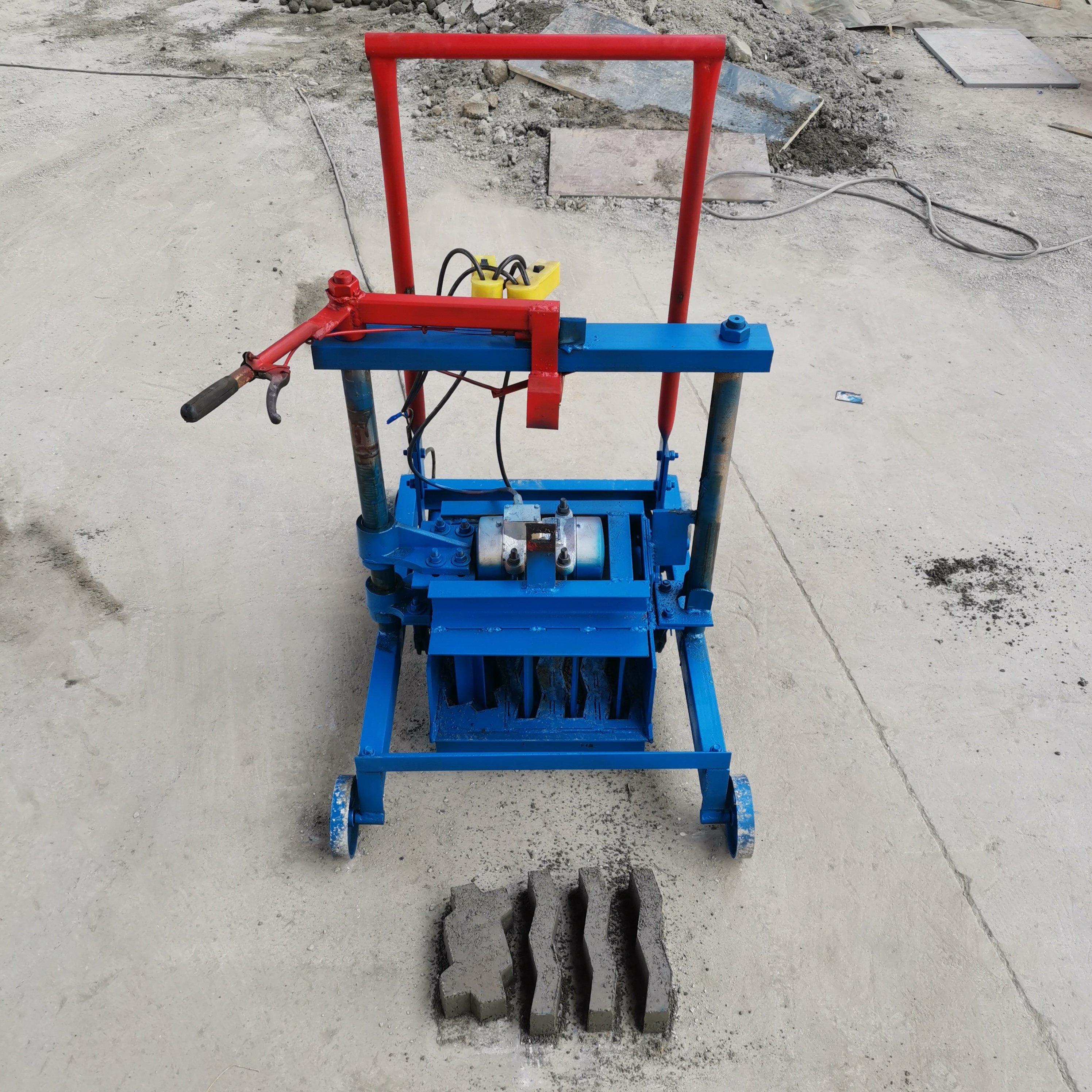 manual brick making machine in papua new guinea KM2-45 Electric Cement Block Machine Producing wave-shaped paving blocks