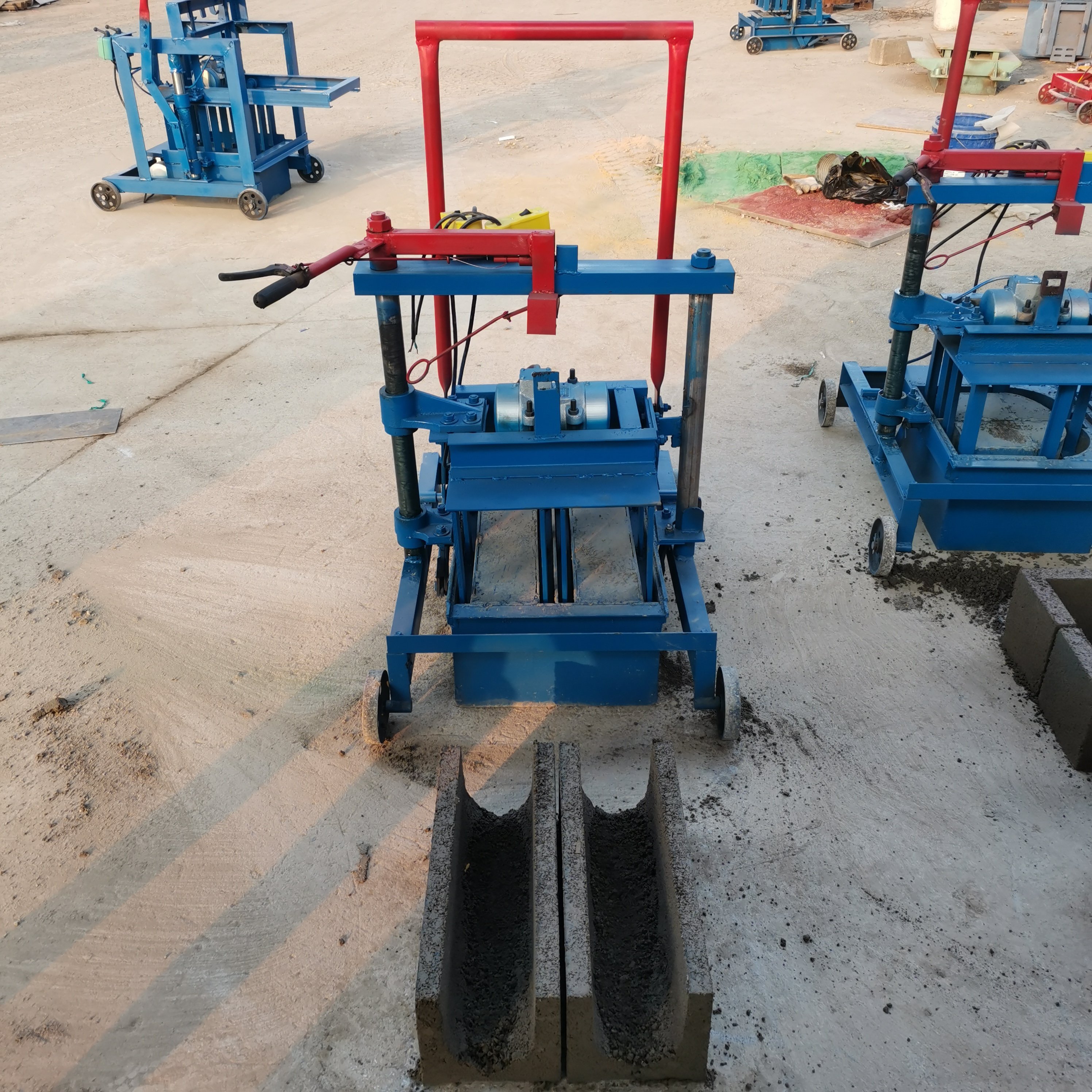 manual brick making machine in papua new guinea KM2-45 Electric Cement Block Machine Producing wave-shaped paving blocks