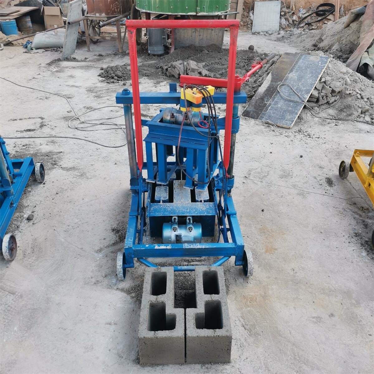 manual brick making machine in papua new guinea KM2-45 Electric Cement Block Machine Producing wave-shaped paving blocks