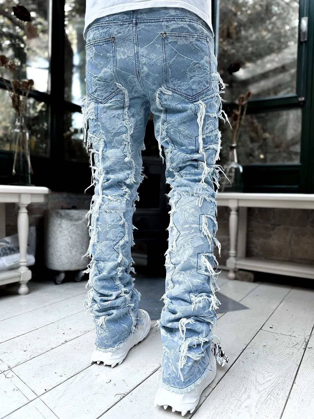 Custom designer men blue distressing stacked jeans Enzyme wash distress denim trousers